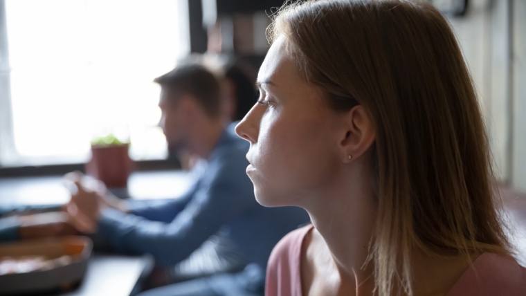 8-Effective-Strategies-for-Dealing-with-Passive-Aggressive-Individuals Woman looking at man who is staring at his phone | 8 Effective Strategies for Dealing with Passive-Aggressive Individuals | Mindful Health Solutions