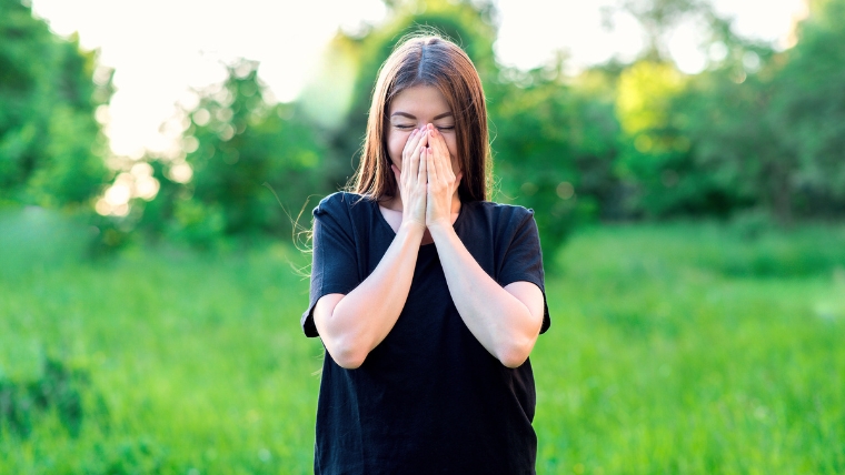 Did You Know 7 Shocking Facts About Esketamine Therapy Young woman standing in field smiling with hands over her mouth | Did You Know 7 Shocking Facts About Esketamine Therapy | Mindful Health Solutions